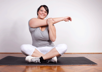 Woman with whiplash stretching- Auto Injury News